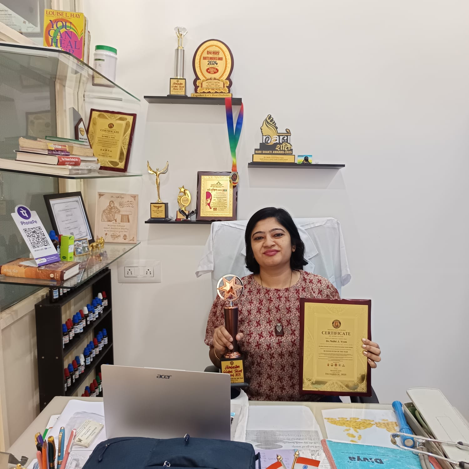 Dr. Nidhi Vyas holding award and certificate